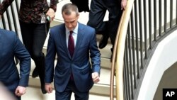President Donald Trump's former campaign manager Corey Lewandowski, center, arrives on Capitol Hill in Washington, Jan. 17, 2018, where his is expected to be interviewed by the House Intelligence Committee regarding the Russia probe.