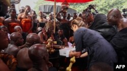 Otumfuo Osei Tutu II, Ghana’s Asante king, receives artifacts returned by the Fowler Museum of UCLA to the Manhyia Palace in Kumasi, Ghana, on February 8, 2024.