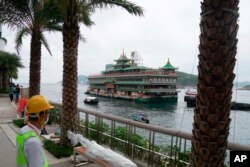 Hong Kong's iconic Jumbo Floating Restaurant is towed away in Hong Kong, Tuesday, June 14, 2022. (AP Photo/Kin Cheung)