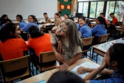 Teeraphong Meesat, 29, known as teacher Bally teaches English in a classroom at the Prasartratprachakit School in Ratchaburi Province, Thailand, July 10, 2019.