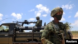 FILE - Soldiers from the Rwandan security forces are seen near the Afungi natural gas site, Mozambique Sept. 22, 2021.