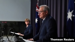 Prime Minister Morrison speaks during a press conference revealing a state-based cyber attack in Canberra