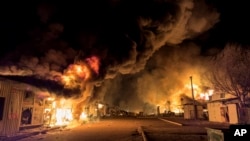 A local market burns after Russian strike in Mykolaiv, Ukraine, Oct. 15, 2024. 