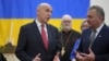 Britain's Defence Secretary John Healey, left, speaks to members as he visits the Ukrainian Catholic Church in central London, Nov. 19, 2024 to mark the 1000 days since Russia's invasion of Ukraine.