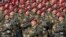 FILE - Indian Special Forces commando G. D. Singh shouts as he leads his battalion during the Republic Day parade in New Delhi.