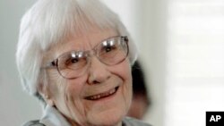 FILE - Author Harper Lee smiles during a ceremony honoring the four new members of the Alabama Academy of Honor at the Capitol in Montgomery, Alabama, Aug. 20, 2007.