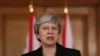 FILE - Britain's Prime Minister Theresa May makes a statement about Brexit in Downing Street in London, March 20, 2019.