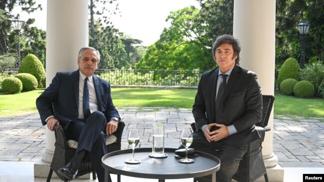 Argentina's current President Alberto Fernandez and President-elect Javier Milei meet at the Olivos Presidential Residence in Buenos Aires, on Nov. 21, 2023. (Argentine Presidency handout via Reuters)