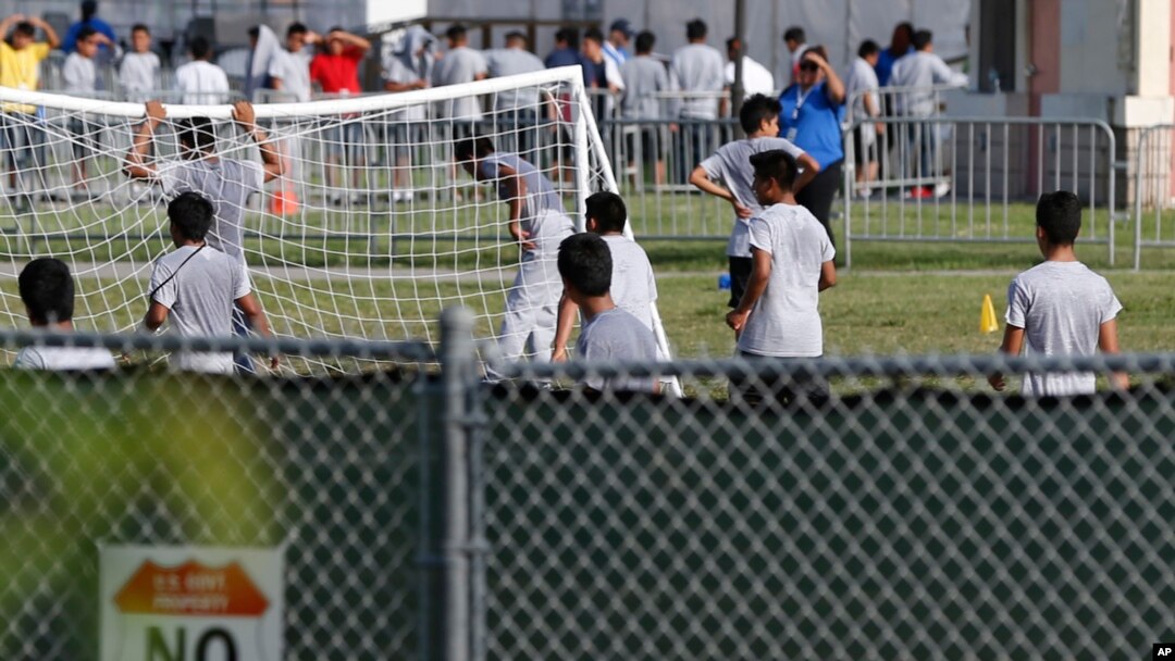 FILE - Immigrant children play outside a former Job Corps site that now houses them in Homestead, Florida, June 18, 2018. 