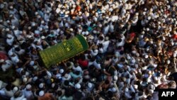 Mourners carry the coffin of Ko Ni, prominent Muslim lawyer who was shot dead, at the Muslim cemetery in Yangon, Myanmar, Jan. 30, 2017. 