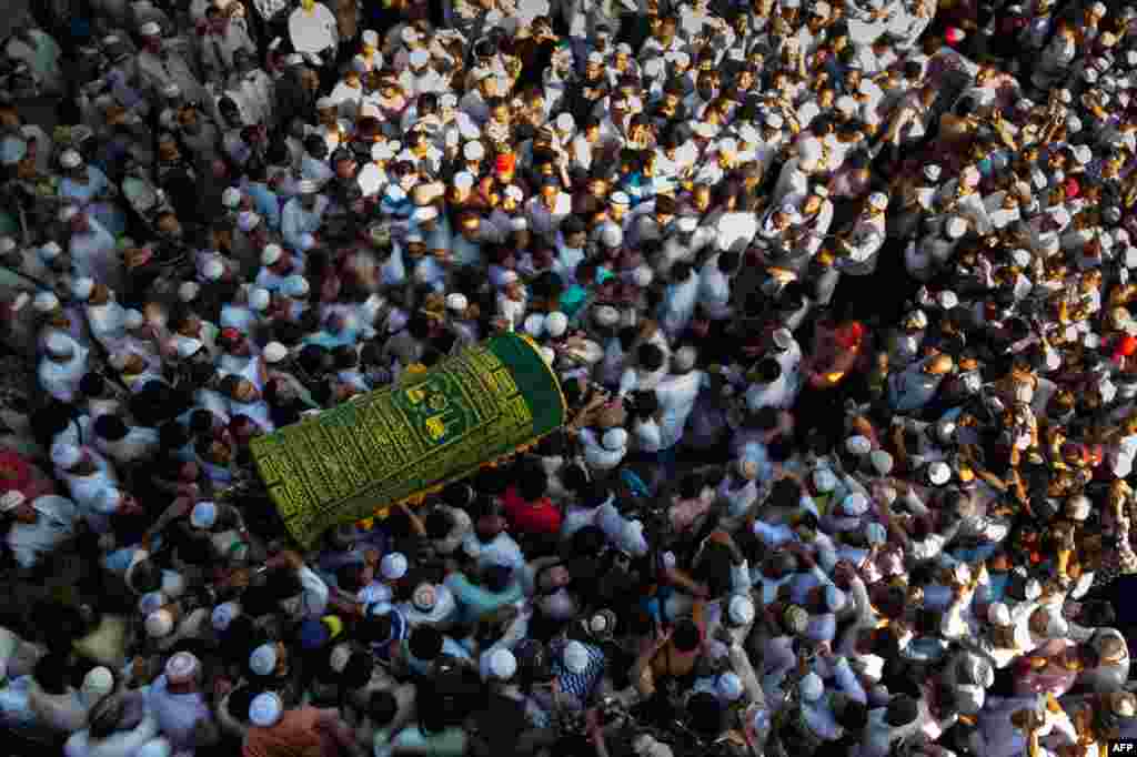 Mourners carry the coffin of prominent Muslim lawyer Ko Ni at the Muslim cemetery in Yangon, Myanmar. The lawyer and advisor to Aung San Suu Kyi, was gunned down outside Yangon airport in what the ruling National League for Democracy party said was a political assassination.