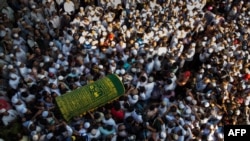 Mourners carry the coffin of Ko Ni, prominent Muslim lawyer who was shot dead, at the Muslim cemetery in Yangon, Myanmar, Jan. 30, 2017. 