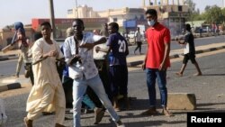 Sudanese demonstrators take part in an anti-government protests in Khartoum, Sudan, Jan. 25, 2019. 