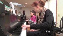 Asians Help Struggling Piano Market