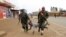 Congolese soldiers arrest a civilian protesting against the government's failure to stop the killings and inter-ethnic tensions in the town of Butembo, in North Kivu province, Democratic Republic of Congo, Aug. 24, 2016. 