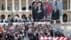 FILE - President Donald Trump and French President Emmanuel Macron during Bastille Day parade on the Champs Elysees avenue in Paris, July 14, 2017. 