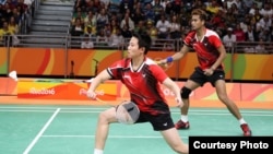 Atlet bulutangkis Indonesia Tontowi Yahya dan Liliyana Natsir dalam pertandingan Olimpiade 2016 di Rio de Janeiro. (Yves Lacroix/Badminton Photo)