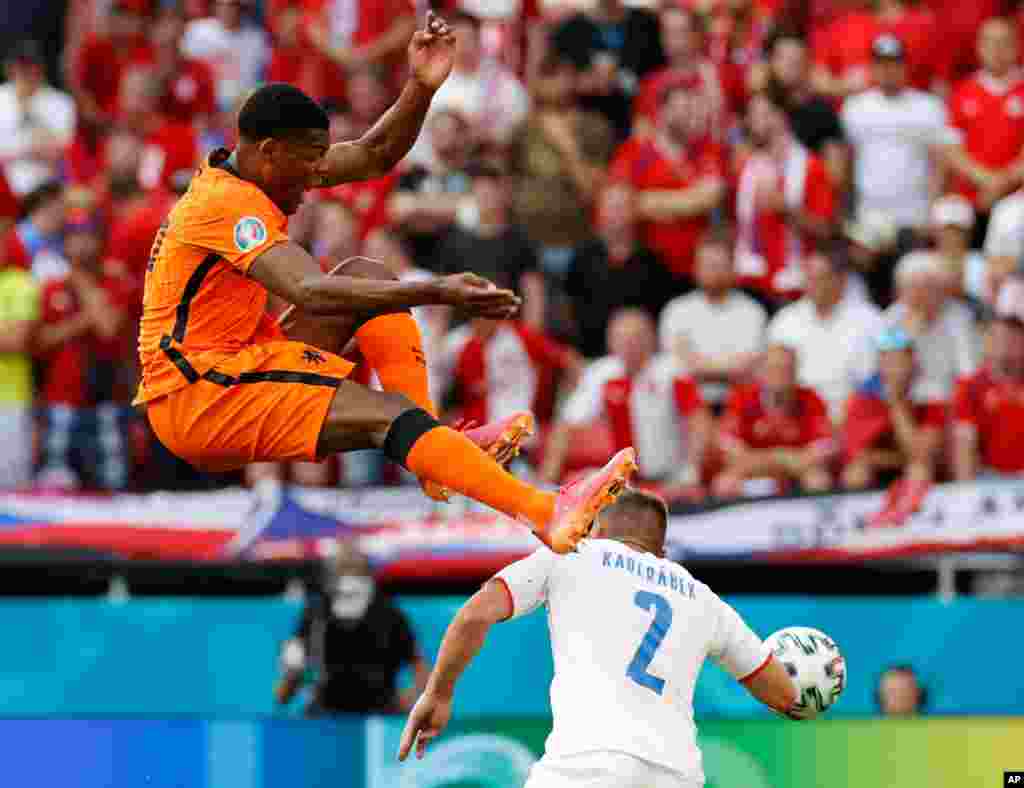 Czech Republic&#39;s Pavel Kaderabek, right, challenges Denzel Dumfries of the Netherlands during the Euro 2020 soccer championship round of 16 match between Netherlands and Czech Republic at the Ferenc Puskas stadium in Budapest, Hungary.