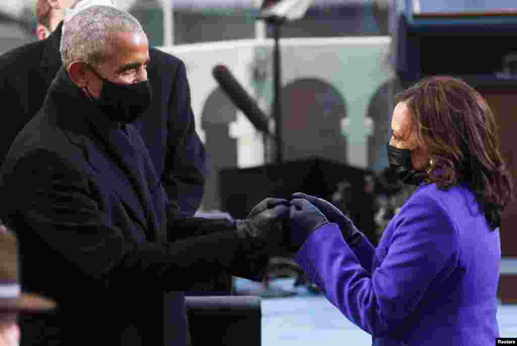 Vice President-elect Kamala Harris greets former U.S. President Barack Obama ahead of the inauguration of Joe Biden as the 46th President of the United States on the West Front of the U.S. Capitol.