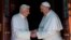 Pope emeritus Benedict XVI (l) is welcomed by Pope Francis on his return to the Vatican from the pontifical summer residence of Castel Gandolf, May 2, 2013.