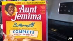 FILE - A box of Aunt Jemima pancake mix sits on a stovetop June 17, 2020, in Harrison, New York, as its maker is changing the name and marketing image of the product and its syrup.