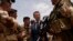 FILE - French President Emmanuel Macron visits French troops in Africa's Sahel region in Gao, northern Mali, May 19, 2017. 