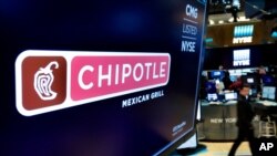 FILE - The logo for Chipotle appears above a trading post on the floor of the New York Stock Exchange. Fedir Hladyr, a 34-year-old Ukrainian, was sentenced to a decade in prison, U.S. prosecutors said Friday.