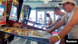 Guests try their luck at Silverball Retro Arcade, which is home to more than 150 fully functional pinball machines in Asbury Park, New Jersey, U.S., August 12, 2022. (REUTERS/Roselle Chen)