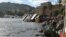 Destroyed yachts lie on the shore after windstorm and the strong sea storm in Rapallo, Italy, Oct. 30, 2018. On Saturday heavy rain caused flooding in Sicily, leaving nine dead.