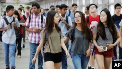 FILE - Students arrive for the first day of school at Stuyvesant High School in New York. 