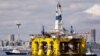 FILE - The oil drilling rig Polar Pioneer is towed toward a dock in Elliott Bay in Seattle, May 14, 2015. The rig was the first of two drilling rigs Royal Dutch Shell was outfitting for Arctic oil exploration. President Barack Obama has designated the bulk of U.S.-owned waters in the Arctic Ocean and certain areas in the Atlantic Ocean as indefinitely off limits to future oil and gas leasing.