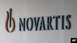 FILE - The logo of Swiss pharmaceutical company Novartis.