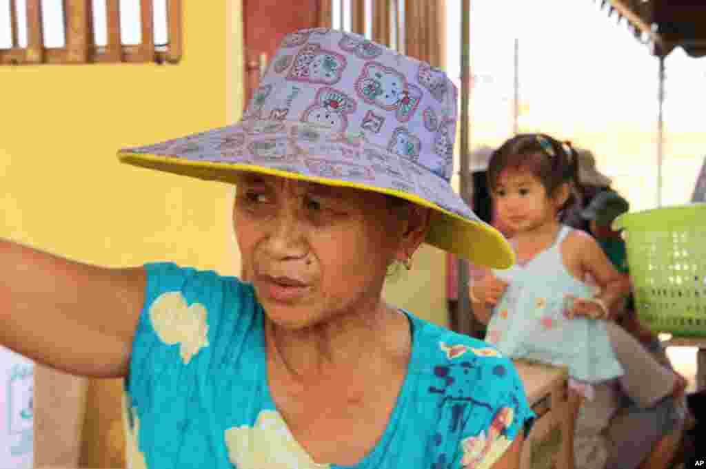 Ouy Kham, a Lao resident of the relocation village says there are not enough trees to grow food. (D. Schearf/VOA)