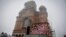 A screen streams the consacration service of the Romanian People's Salvation Cathedral still under construction in Bucharest, Nov. 25, 2018. 