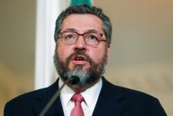 FILE - Brazilian Foreign Minister Ernesto Araujo delivers a statement to members of the media at the Department of State in Washington, Sept. 13, 2019.