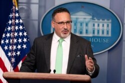 FILE - In this March 17, 2021, file photo, Education Secretary Miguel Cardona speaks during a press briefing at the White House in Washington.