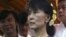 Burma's opposition leader Aung San Suu Kyi during the opening ceremony of a photo exhibition entitled "Aung San Suu Kyi, The Burmese Way to Democracy" at Institute of French in Rangoon, May 17, 2012. 