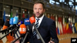 FILE - Estonia's Foreign Minister Margus Tsahkna speaks to the media as he arrives for a meeting of EU foreign ministers at the European Council building in Brussels, Jan. 27, 2025. 