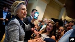 Democratic presidential candidate Hillary Clinton greets members of the audience after speaking at a rally at the International Brotherhood of Electrical Workers Circuit Center in Pittsburgh, Tuesday, June 14, 2016. (AP Photo/Andrew Harnik)