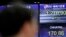 A currency trader works near the screens showing the foreign exchange rates at the foreign exchange dealing room in Seoul, South Korea, June 4, 2020.
