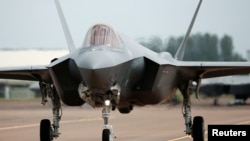 FILE - A Lockheed Martin F-35A fighter taxis along a runway at the Royal International Air Tattoo at Fairford, Britain, July 8, 2016. 