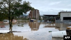 Vehicles are partially submerged following heavy rains in the town of Kiseljak, about twenty kilometres west of Sarajevo on Oct. 4, 2024. 