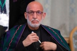 Former Afghan President Hamid Karzai prepares to attend a meeting in Moscow, May 28, 2019.