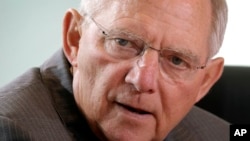 German Finance Minister Wolfgang Schaeuble attends the weekly cabinet meeting at the chancellery, in Berlin, Germany, May 22, 2013.