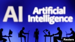 资料照：“人工智能(AI)”字样前方呈现着电脑和智能手机的图像。