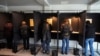 People vote in voting booths during early voting in the Lithuanian general elections, in Vilnius, Lithuania, Oct. 8, 2024.