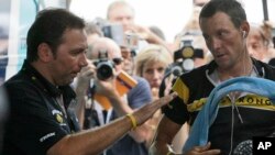 Johan Bruyneel (izquierda) junto a su pupilo, Lance Armstrong, en julio de 2009, en Mónaco.