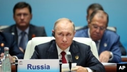 Russian President Vladimir Putin is seen attending the Dialogue of Emerging Market and Developing Countries on the sideline of the BRICS Summit in Xiamen, China, Sept. 5, 2017.