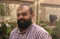 Eslam Karam, 33, says he’s sad he cannot pray in the mosque or visit relatives this holiday, but adds that his fear of the virus is greater than his need to get out, in Cairo, July 31, 2020. (Hamada Elrasam/VOA)