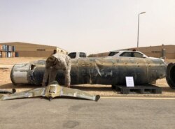 FILE - A projectile and a drone launched at Saudi Arabia by Yemen's Houthis are displayed at a Saudi military base, Al-Kharj, Saudi Arabia, June 21, 2019.